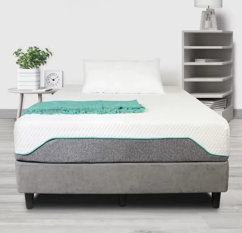 A TFM foam mattress with a teal-trimmed cover, styled in a bright modern bedroom