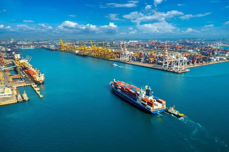 Aerial view of a container port with cargo ships and stacked freight containers